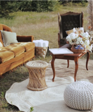 Vintage furniture and flowers in a sunny field.